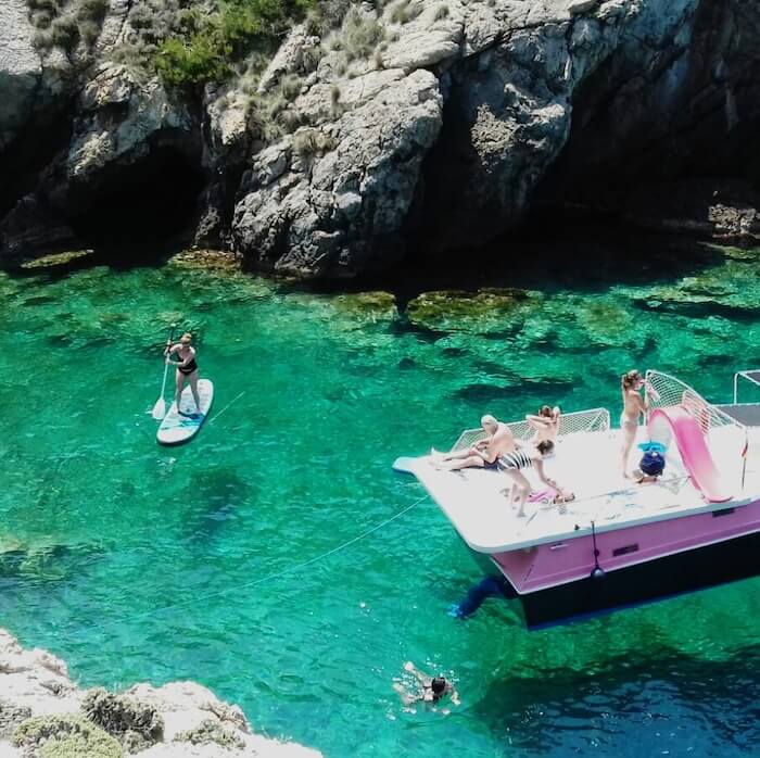 Paddleboarding near the coastline of Mallorca.